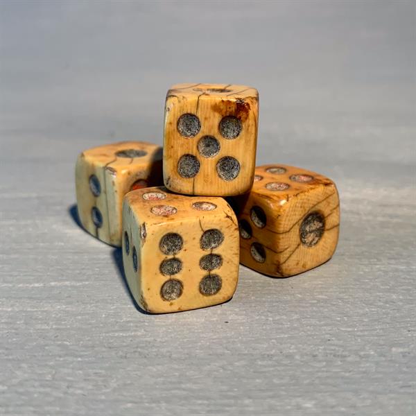 12. Four Ivory Dice