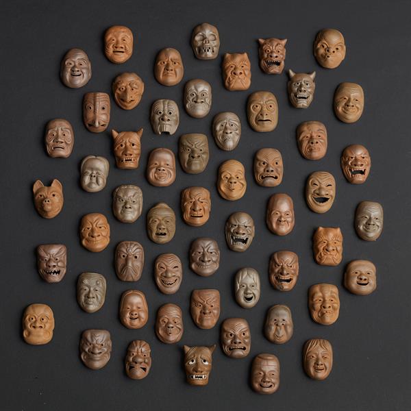 16. 54 Pottery Masks